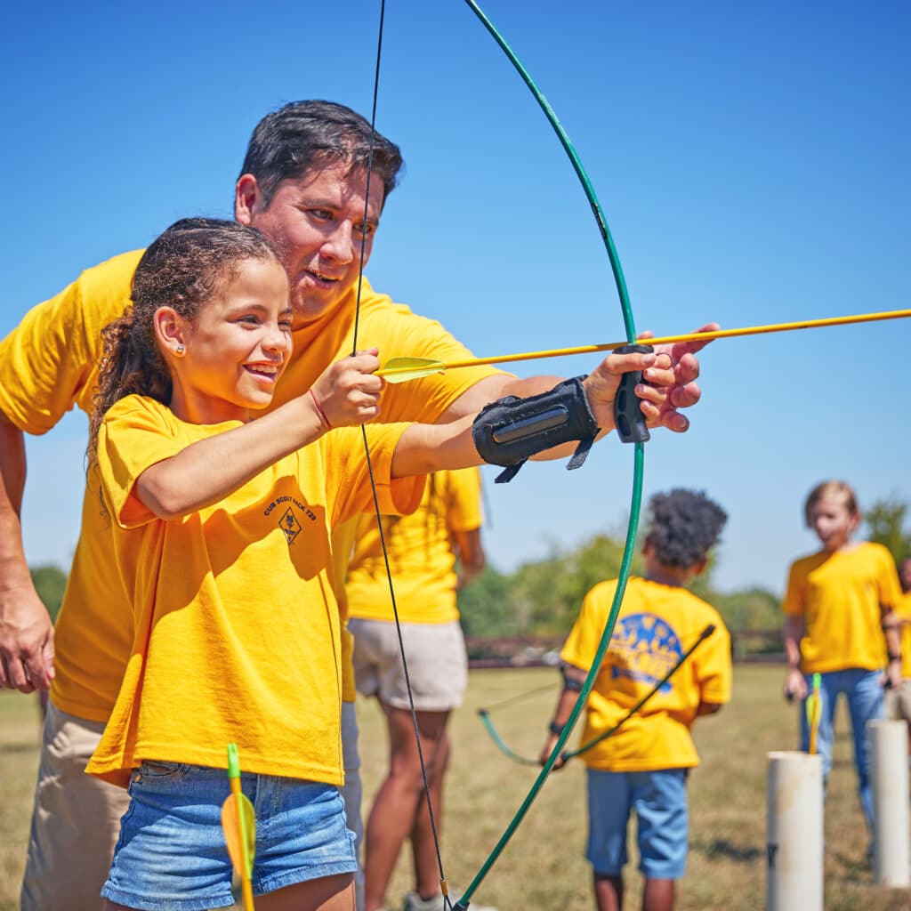 Shooting bows and arrows at a range